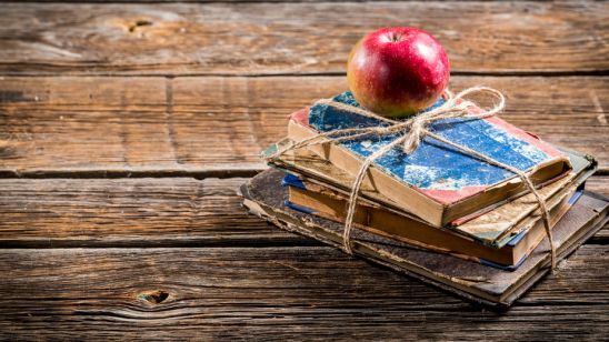 33951343 - old books and apple on school desk